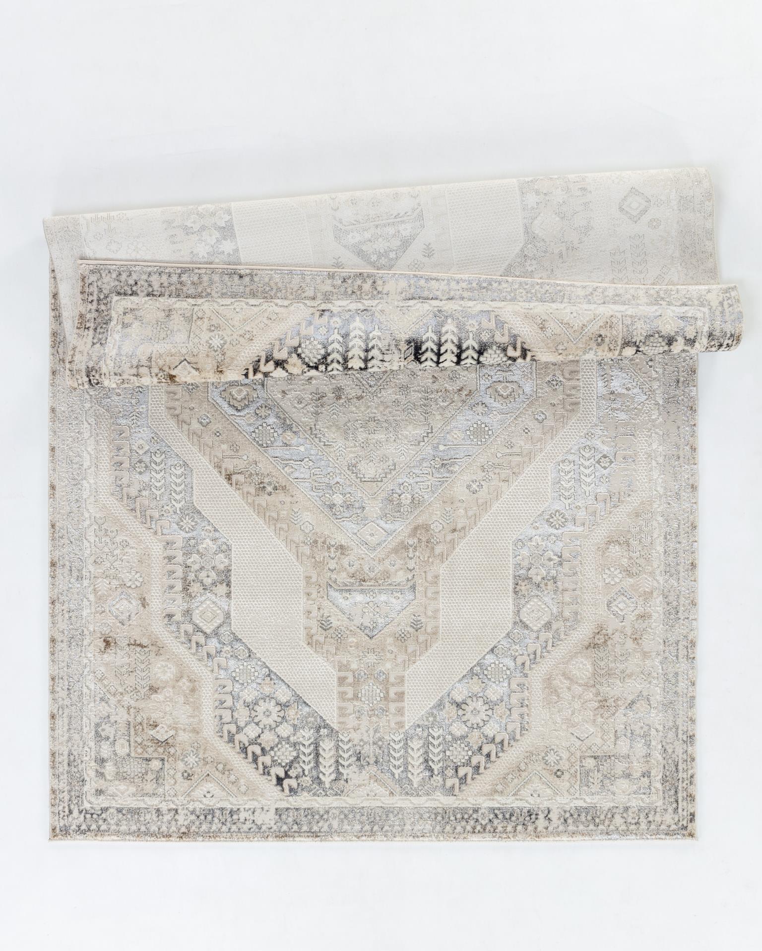 Omari 5X8 Area Rug - Adams Furniture